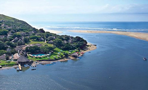 Arial shot of umngazi hotel and spa with a view of the umngazi river that meets the ocean