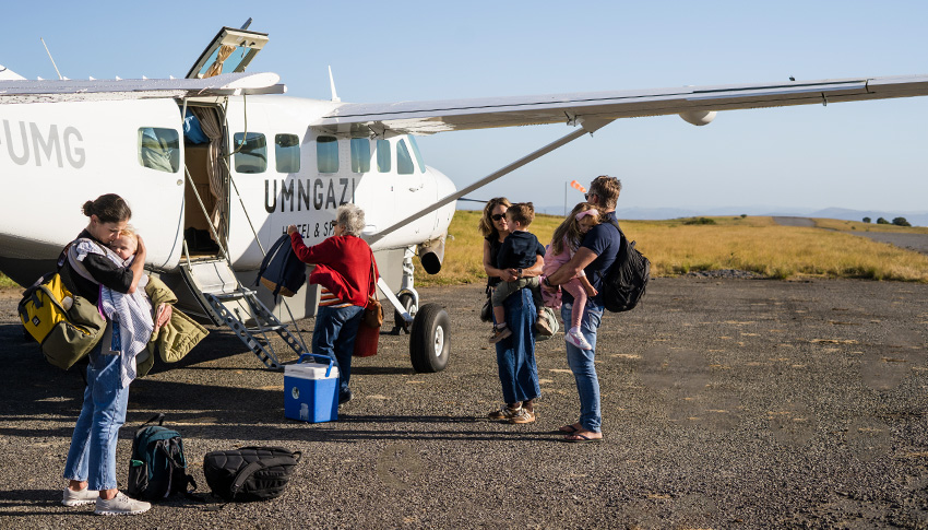 Umngazi hotel guests disembarking a plane, part of how to get to Umngazi from Johannesburg