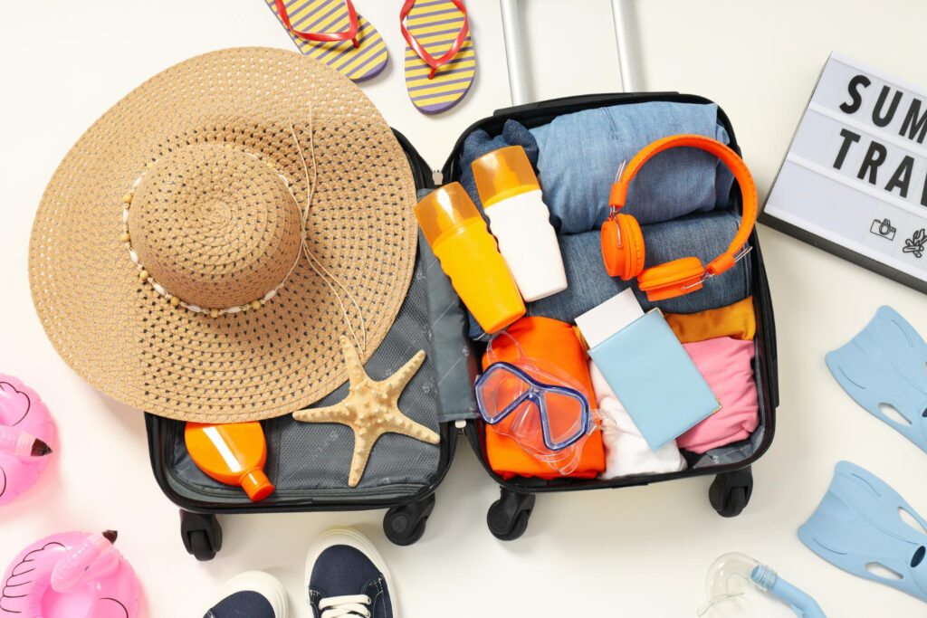 A fully packed suitcase with travelling items, highlighting what to pack for a Wild Coast holiday